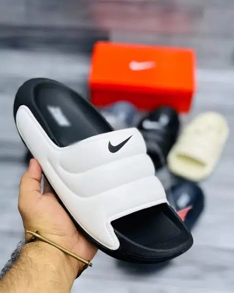 Imported white over black nike slippers